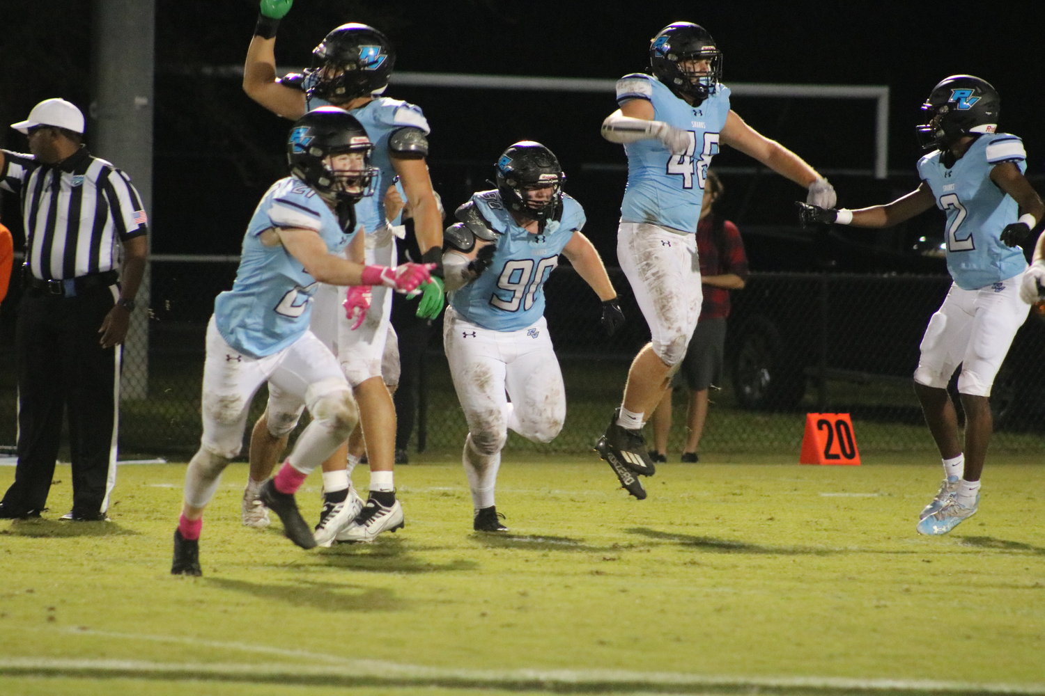 The Sharks’ defense celebrates after a measurement confirmed they had stopped the Bulldogs short on a fourth down attempt in the first half.